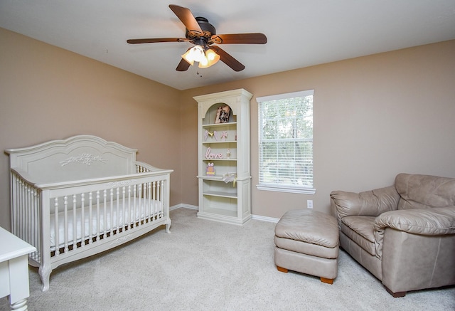 bedroom with carpet floors, a ceiling fan, and baseboards