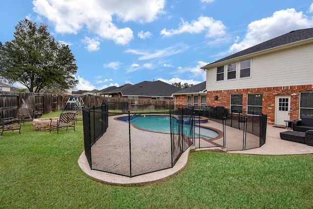 view of pool featuring an outdoor fire pit, a fenced backyard, a lawn, and a patio