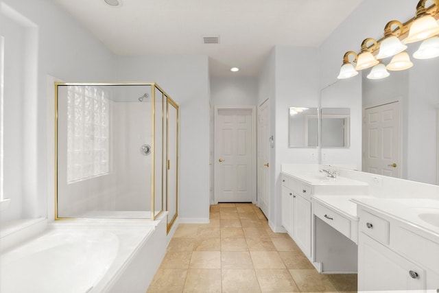 bathroom with vanity, tile patterned flooring, and shower with separate bathtub