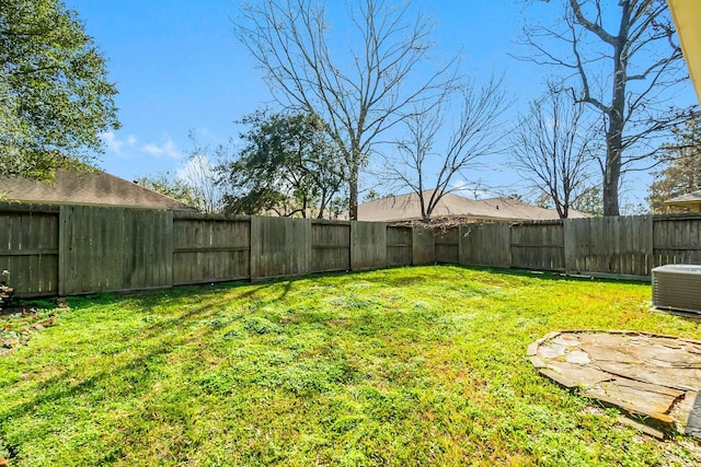 view of yard featuring central AC