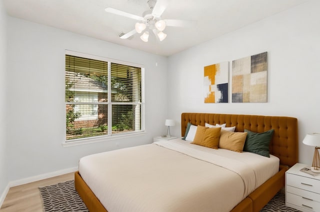 bedroom featuring ceiling fan and hardwood / wood-style floors