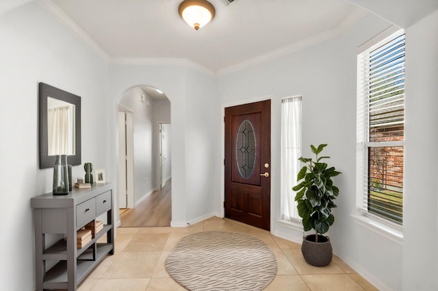 tiled foyer with crown molding