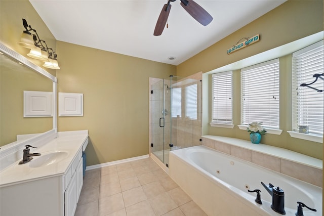 bathroom with tile patterned flooring, vanity, shower with separate bathtub, and a healthy amount of sunlight