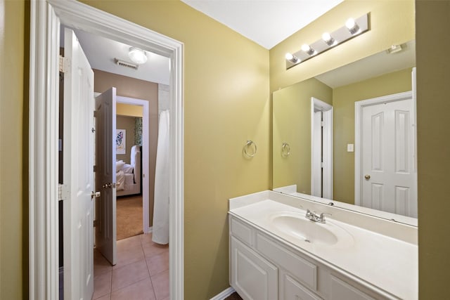 bathroom with vanity and tile patterned floors