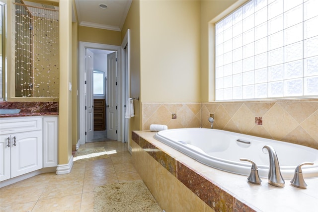 bathroom with tile patterned flooring, crown molding, a healthy amount of sunlight, and vanity