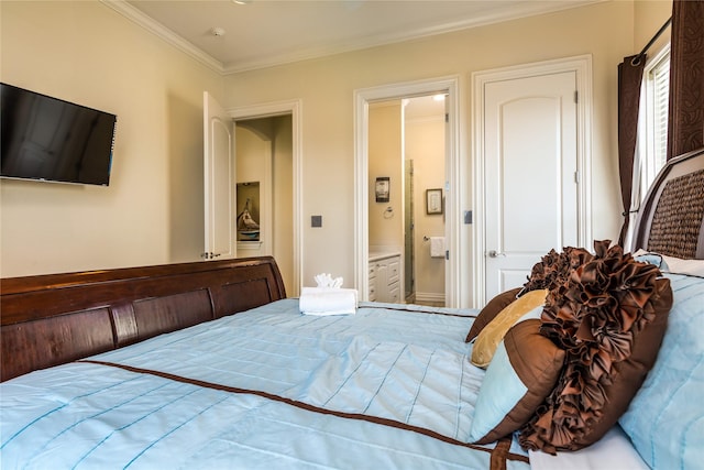 bedroom featuring crown molding and ensuite bathroom