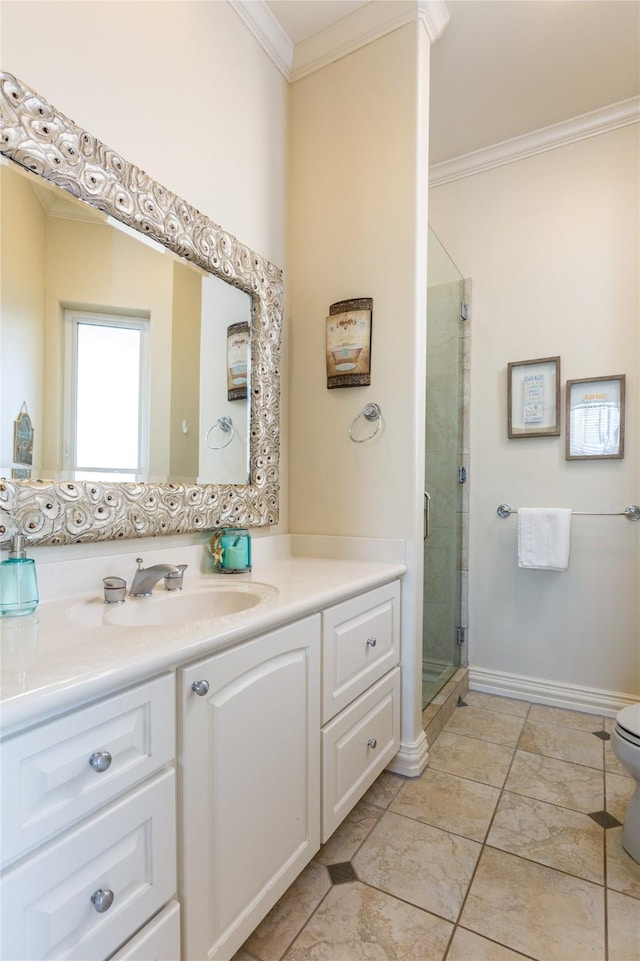 bathroom featuring crown molding, vanity, and a shower with shower door