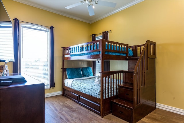 bedroom featuring hardwood / wood-style flooring and ornamental molding