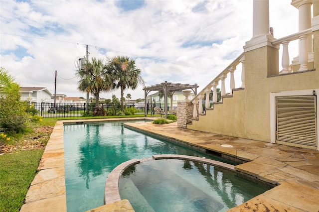 view of pool with an in ground hot tub, a patio, and a pergola