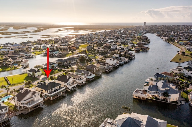 aerial view at dusk with a water view