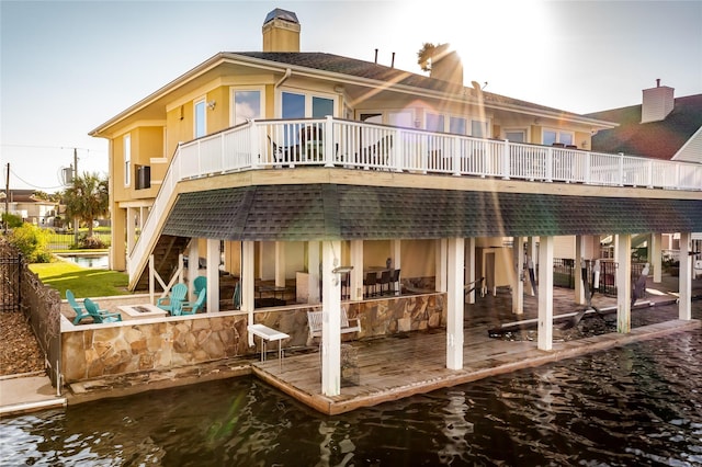 back of house featuring a water view