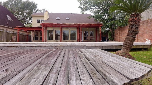 wooden terrace with a pergola