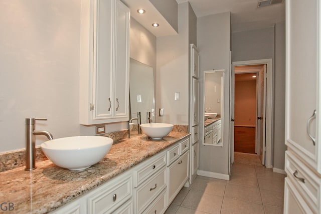 bathroom featuring tile patterned floors and vanity