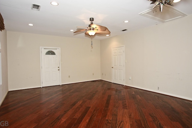 empty room featuring ceiling fan and dark hardwood / wood-style floors