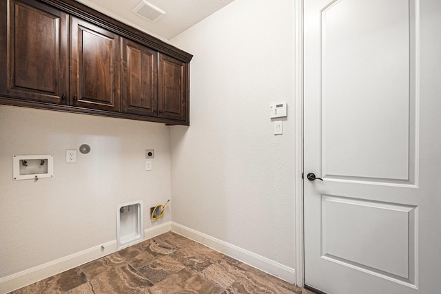 laundry area featuring washer hookup, cabinets, hookup for a gas dryer, and hookup for an electric dryer