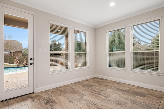 interior space with ornamental molding and a wealth of natural light