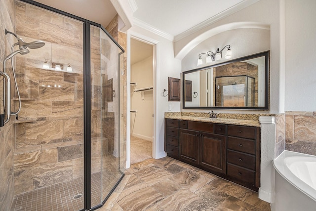 bathroom featuring independent shower and bath, ornamental molding, and vanity