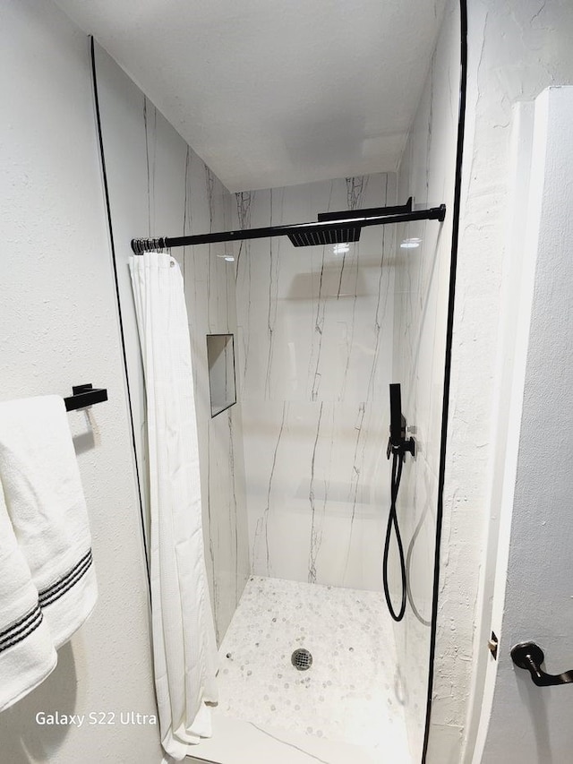 bathroom featuring walk in shower