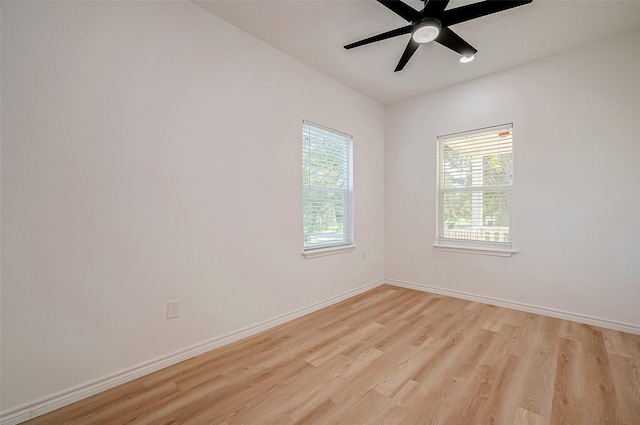 spare room with ceiling fan and light hardwood / wood-style floors