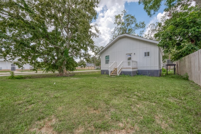 back of property featuring a yard