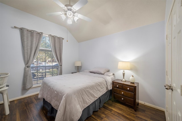 bedroom featuring lofted ceiling, dark hardwood / wood-style floors, and ceiling fan