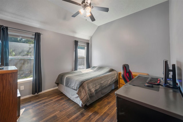 bedroom with ceiling fan, dark hardwood / wood-style flooring, vaulted ceiling, and multiple windows