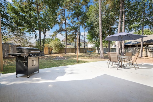 view of patio / terrace featuring a grill and an outdoor fire pit