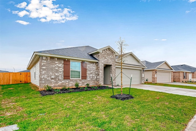 view of front of house with a garage and a front lawn