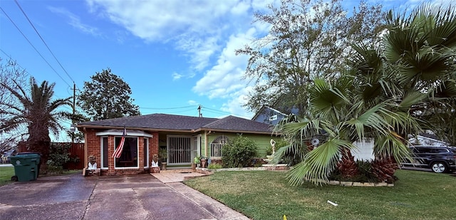 bungalow-style home with a front lawn