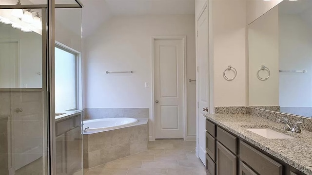 full bathroom with a garden tub, a shower stall, and vanity