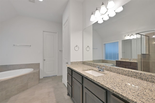 16715 Ramsay Cascades Dr, Humble, TX 77346 - full bath featuring vaulted ceiling, a bath, a stall shower, tile patterned flooring, and vanity