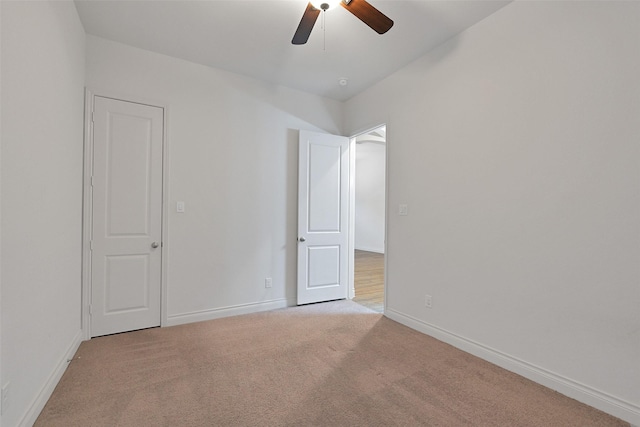 16715 Ramsay Cascades Dr, Humble, TX 77346 - unfurnished bedroom with baseboards, light carpet, and ceiling fan