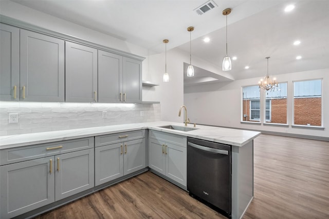 kitchen featuring dishwasher, sink, and gray cabinetry