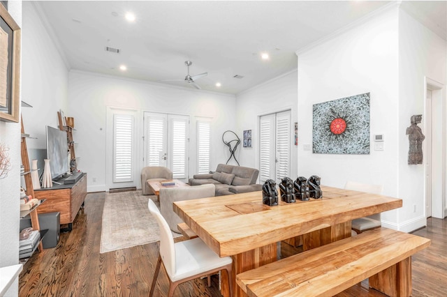 dining area with hardwood / wood-style flooring, ceiling fan, and ornamental molding