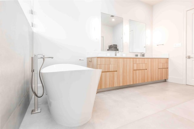 bathroom with vanity and a tub to relax in