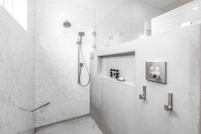 bathroom featuring a shower and concrete flooring