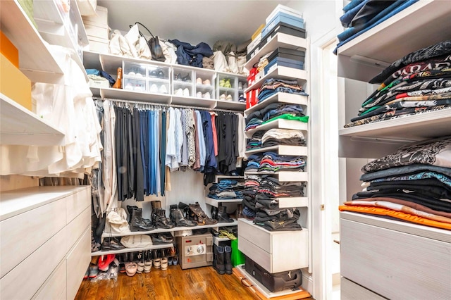 spacious closet with hardwood / wood-style floors