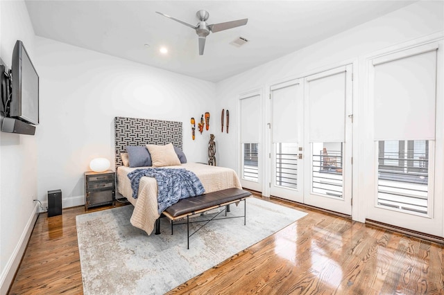 bedroom with ceiling fan, access to outside, and light hardwood / wood-style floors