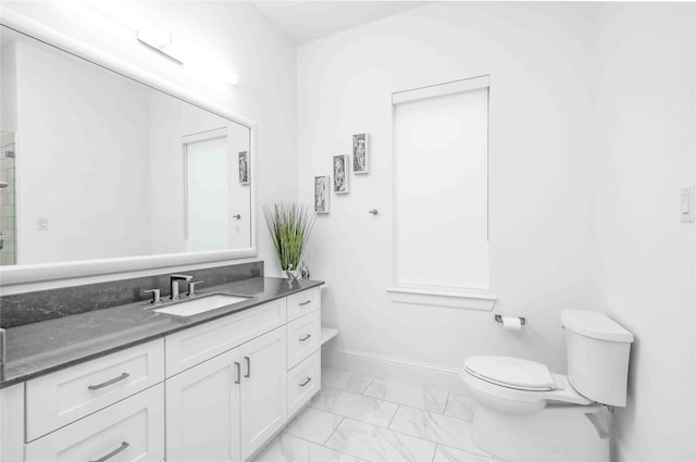 bathroom featuring toilet and vanity