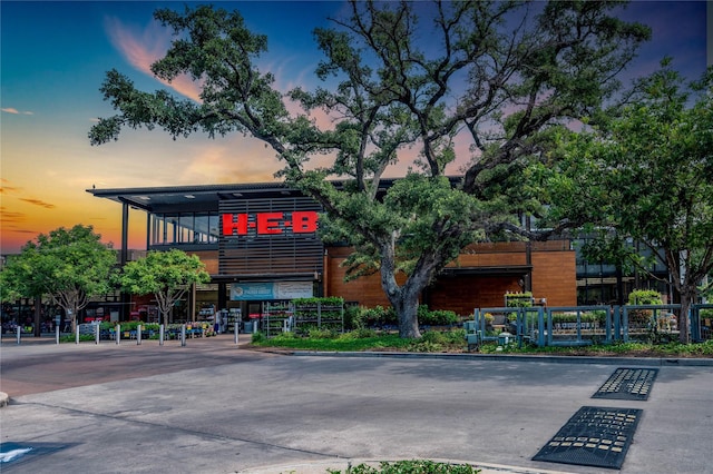 view of outdoor building at dusk