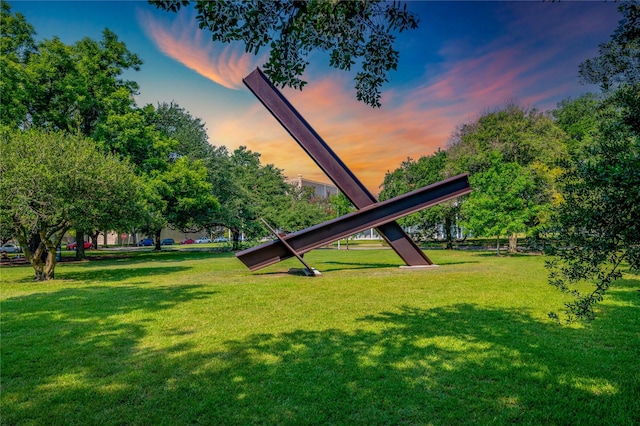 view of property's community with a lawn