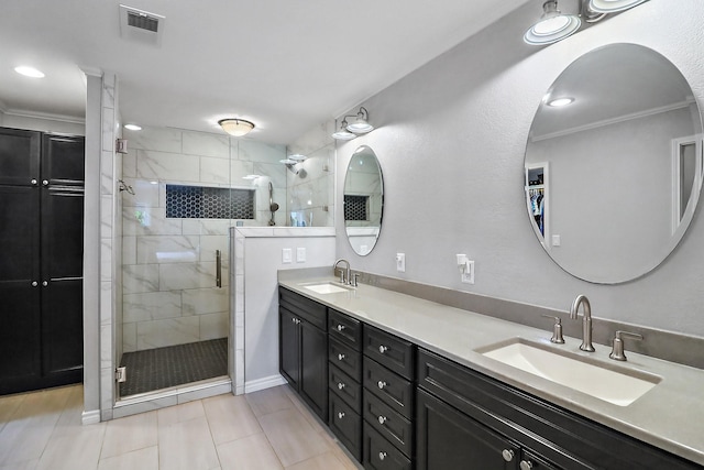 bathroom featuring ornamental molding, vanity, and a shower with shower door