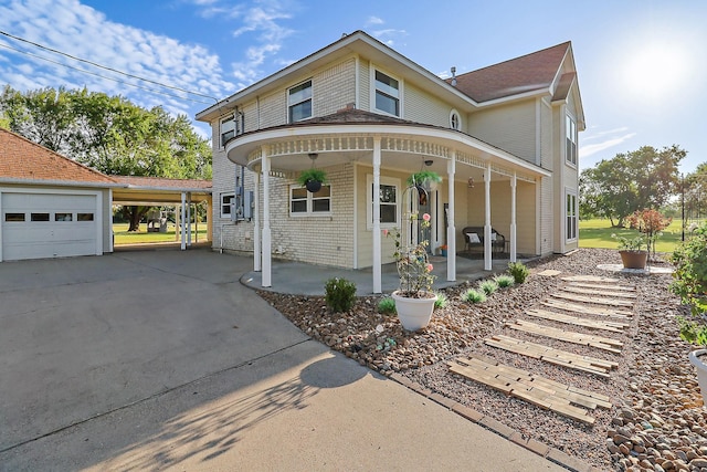 view of front of property featuring a garage and covered porch