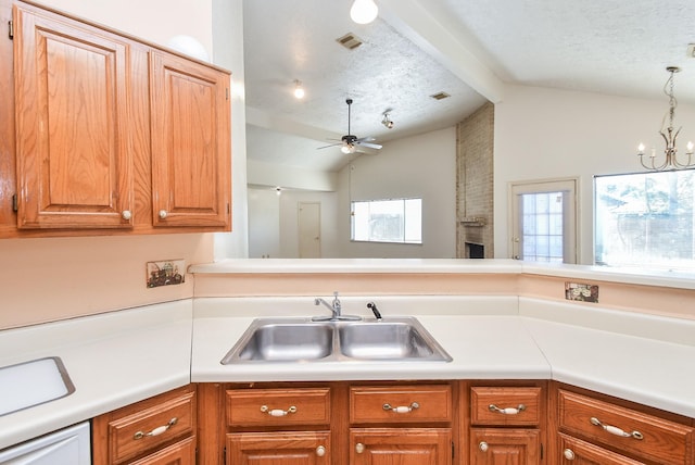 1478 Willow Wisp Dr, Missouri City, TX 77489 - kitchen featuring a sink, a brick fireplace, light countertops, a textured ceiling, and ceiling fan