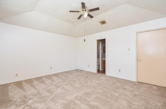 1478 Willow Wisp Dr, Missouri City, TX 77489 - empty room featuring light colored carpet, lofted ceiling, ceiling fan, and a textured ceiling