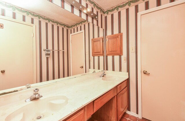 1478 Willow Wisp Dr, Missouri City, TX 77489 - bathroom featuring wallpapered walls, double vanity, and tile patterned flooring
