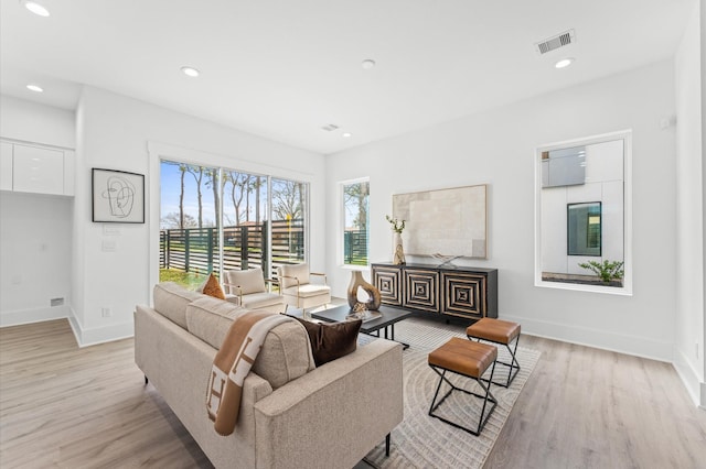 living room with light hardwood / wood-style flooring