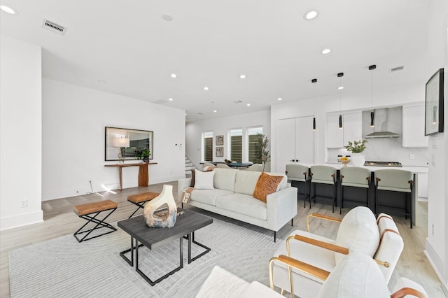 living room with light hardwood / wood-style flooring