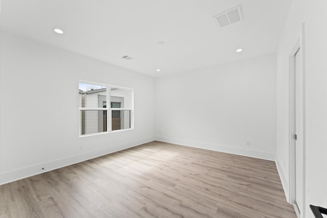 spare room featuring light hardwood / wood-style flooring