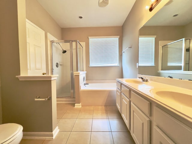 full bathroom with tile patterned flooring, vanity, separate shower and tub, and toilet